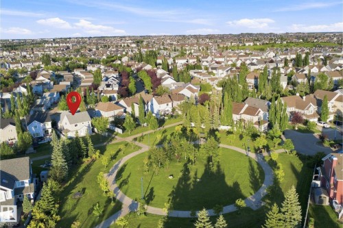 Aerial view of a residential neighborhood with a central green space - 1328 80 Street Sw, Edmonton, AB - Outdoor With View