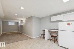 Lower-level living space featuring recessed lighting and a built-in counter - 