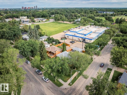 Aerial perspective showcasing a residential neighborhood with a prominent commercial building - 8202 93A Avenue Nw, Edmonton, AB - Outdoor With View