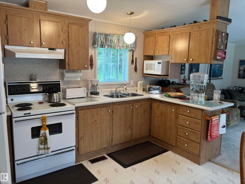 #10A 185073 Twp Rd 654, Rural Athabasca County, AB - Indoor Photo Showing Kitchen With Double Sink