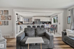 Open concept living area featuring wood-finish flooring - 