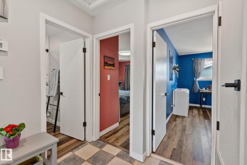 Hallway with light gray walls and a checkered floor pattern - 4723 105 Street Nw, Edmonton, AB - Indoor Photo Showing Other Room
