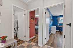 Hallway with light gray walls and a checkered floor pattern - 