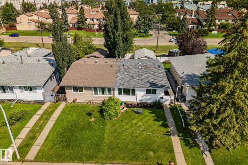 Duplex property featuring a split-level design with distinct rooflines and front entrances - 4723 105 Street Nw, Edmonton, AB - Outdoor