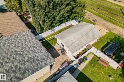Detached garage with asphalt shingle roof - 