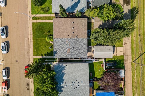 Aerial perspective showcasing a residential property with a shingle roof and a spacious backyard - 4723 105 Street Nw, Edmonton, AB - Outdoor