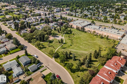 Expansive green space featuring mature trees and winding pathways - 4723 105 Street Nw, Edmonton, AB - Outdoor With View