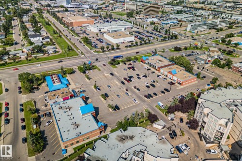 Aerial perspective of a commercial area featuring multiple retail buildings with parking lots - 4723 105 Street Nw, Edmonton, AB - Outdoor With View