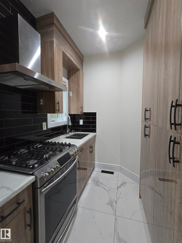 228 36 Street Sw, Edmonton, AB - Indoor Photo Showing Kitchen With Double Sink