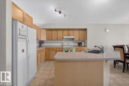 2918 33 Street Nw, Edmonton, AB - Indoor Photo Showing Kitchen With Double Sink