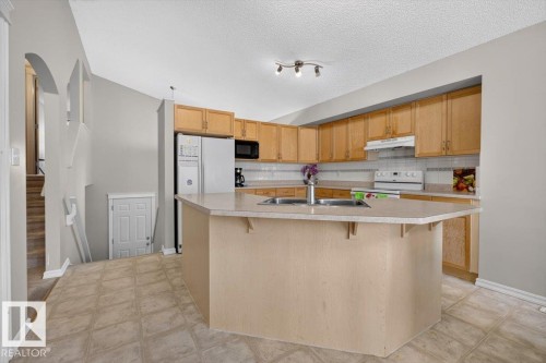 2918 33 Street Nw, Edmonton, AB - Indoor Photo Showing Kitchen With Double Sink