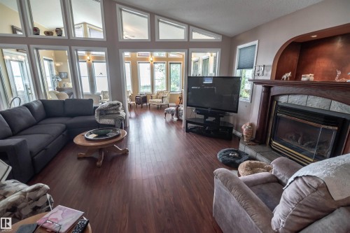 4740 Sunset Drive, Rural Lac Ste. Anne County, AB - Indoor Photo Showing Living Room With Fireplace