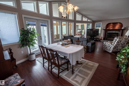 4740 Sunset Drive, Rural Lac Ste. Anne County, AB - Indoor Photo Showing Dining Room With Fireplace