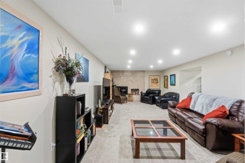 Spacious interior with recessed lighting, light-toned walls, and neutral carpeting - 11351 35A Avenue Nw, Edmonton, AB - Indoor