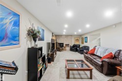 Spacious interior with recessed lighting, light-toned walls, and neutral carpeting - 