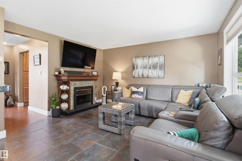 #43 27507 Twp Road 544, Rural Sturgeon County, AB - Indoor Photo Showing Living Room With Fireplace