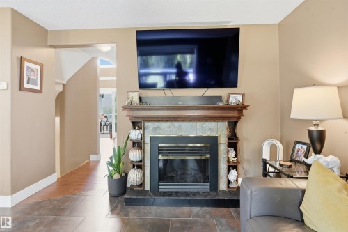 #43 27507 Twp Road 544, Rural Sturgeon County, AB - Indoor Photo Showing Living Room With Fireplace