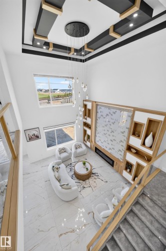 Vaulted ceilings with recessed lighting and a multi-level chandelier - 423 Robinson Bv, Leduc, AB - Indoor Photo Showing Other Room