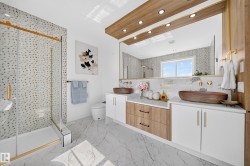 Dual floating vanities with vessel sinks and integrated storage - 