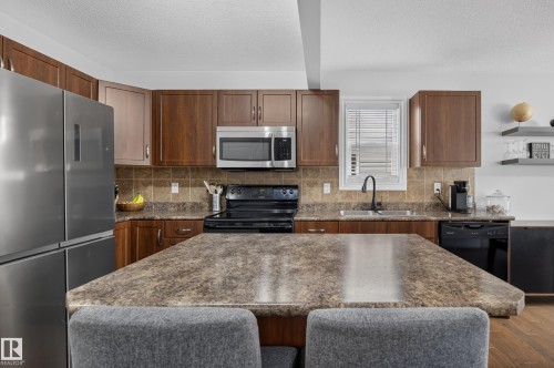#10 85 Spruce Village Dr Dr, Spruce Grove, AB - Indoor Photo Showing Kitchen With Stainless Steel Kitchen With Double Sink With Upgraded Kitchen
