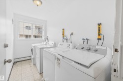 Dedicated laundry area featuring a window, tile flooring, and multiple appliance hookups - 
