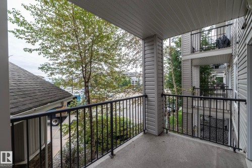 Private balcony featuring concrete flooring and black metal railings - #6201 7331 South Terwillegar Dr Nw, Edmonton, AB - Outdoor With Balcony With Exterior