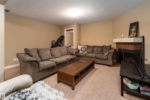 3514 Goodridge Bay Nw, Edmonton, AB - Indoor Photo Showing Living Room With Fireplace