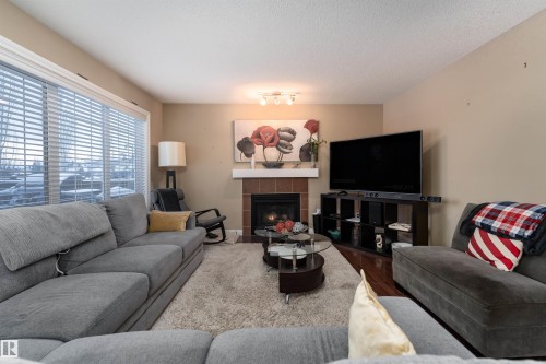 3514 Goodridge Bay Nw, Edmonton, AB - Indoor Photo Showing Living Room With Fireplace