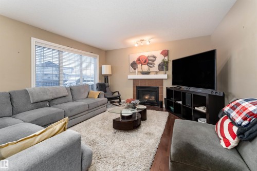 3514 Goodridge Bay Nw, Edmonton, AB - Indoor Photo Showing Living Room With Fireplace