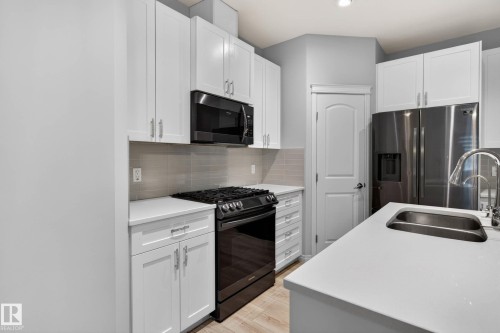 17928 62 Street Nw, Edmonton, AB - Indoor Photo Showing Kitchen With Double Sink