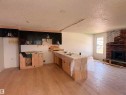 Open concept space featuring new wood-finish flooring - 18007 73 Avenue Nw, Edmonton, AB  - Indoor With Fireplace 