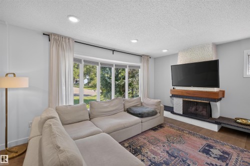 14447 107A Avenue Nw, Edmonton, AB - Indoor Photo Showing Living Room With Fireplace