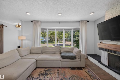 14447 107A Avenue Nw, Edmonton, AB - Indoor Photo Showing Living Room With Fireplace