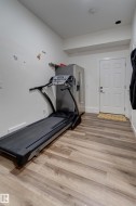 Light wood-finish flooring extending throughout the space - 