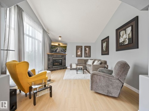 4115 58 Street, Beaumont, AB - Indoor Photo Showing Living Room With Fireplace