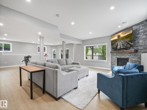 4115 58 Street, Beaumont, AB - Indoor Photo Showing Living Room With Fireplace