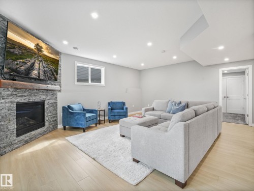 4115 58 Street, Beaumont, AB - Indoor Photo Showing Living Room With Fireplace