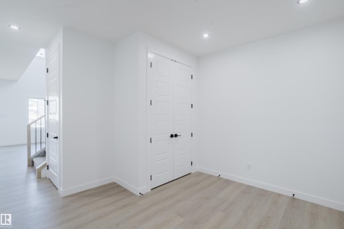 Interior room featuring light wood-finish flooring, white walls, and recessed lighting - 8728 182 Avenue Nw, Edmonton, AB - Indoor Photo Showing Other Room