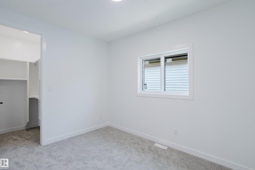 Room featuring light-toned walls, white trim, recessed lighting, and grey carpet flooring - 8728 182 Avenue Nw, Edmonton, AB - Indoor Photo Showing Other Room