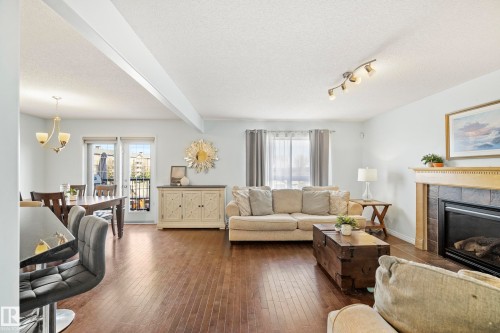 1212 37C Avenue Nw, Edmonton, AB - Indoor Photo Showing Living Room With Fireplace