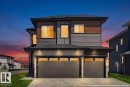 Contemporary multi-level residence featuring a dark gray and wood-finish facade - 6001 19 Street, Nisku, AB  - Outdoor 