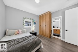 Neutral gray walls complemented by wood-finish flooring - 