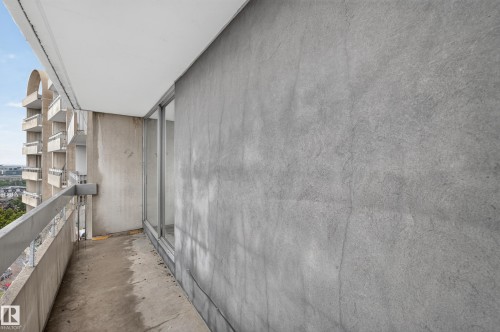 Exterior balcony featuring a concrete floor, concrete wall, and metal railing - #1804 10883 Saskatchewan Dr Nw, Edmonton, AB - Outdoor With Balcony