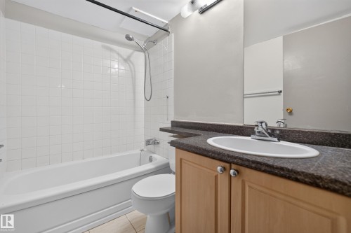 Bathroom featuring a tub/shower combination with white subway tile surround - #1508 10883 Saskatchewan Dr Nw Nw, Edmonton, AB - Indoor Photo Showing Bathroom