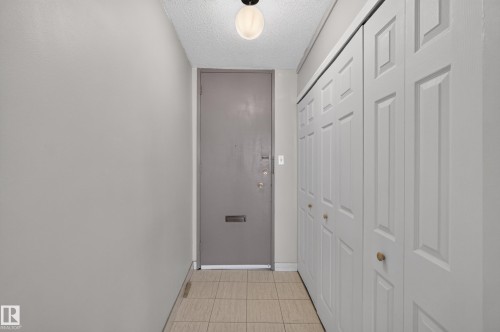 Entryway with neutral wall finishes and a flush-mount ceiling light - #1508 10883 Saskatchewan Dr Nw Nw, Edmonton, AB - Indoor Photo Showing Other Room