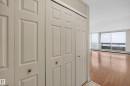 Bifold closet doors with brass-finish knobs providing storage - #1508 10883 Saskatchewan Dr Nw Nw, Edmonton, AB  - Indoor Photo Showing Other Room 