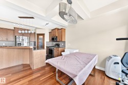Bedroom featuring bold wall color, carpet flooring, a ceiling-mounted light fixture, built-in closet with bi-fold doors, and a white interior door - 