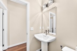 Double vanity featuring rectangular vessel sinks, granite countertops, and wood cabinetry - 