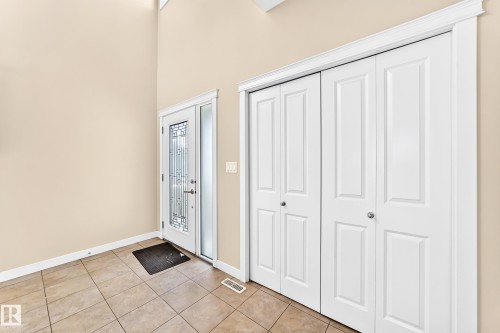 Entryway featuring a decorative glass front door, transom window, and sidelight - 2923 16 Street Nw, Edmonton, AB - Indoor Photo Showing Other Room