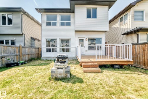 Rear elevation featuring horizontal white siding - 2923 16 Street Nw, Edmonton, AB - Outdoor With Deck Patio Veranda With Exterior